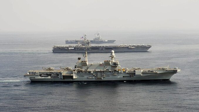800px-Carriers_Cavour_550_-_Harry_S._Truman_CVN-75_and_Charles_de_Gaulle_R91_underway_in_2013